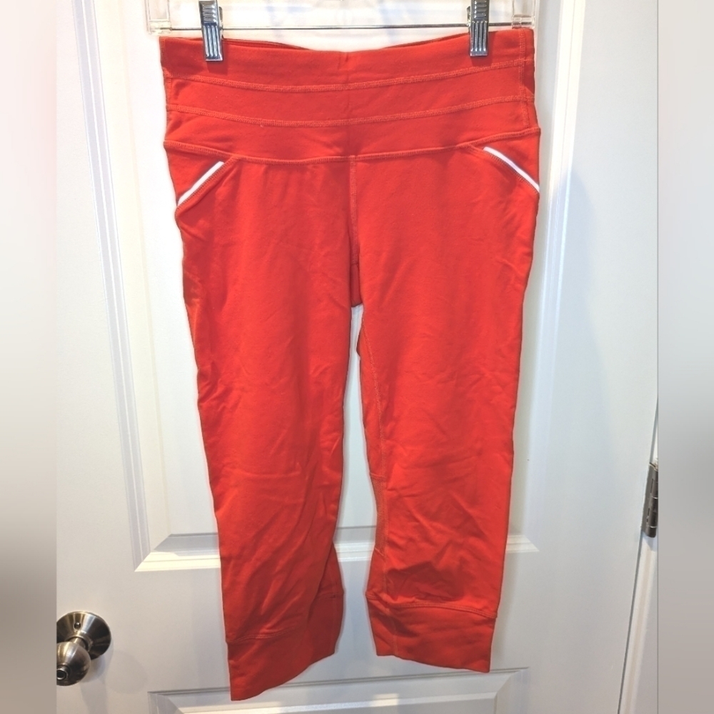 Athleta Orange Relay Capri Reflective Leggings Size Small